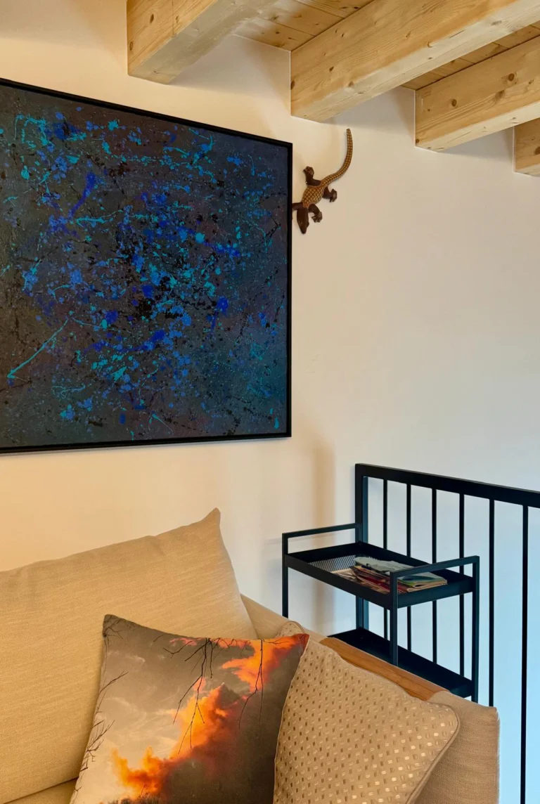 Art by Karīna Ābiķe adds colour and personal expression to the mezzanine lounge, alongside soft textiles and exposed timber.